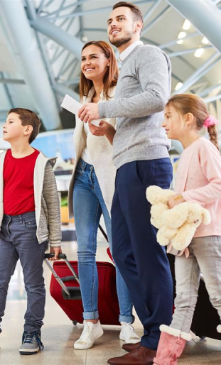 Professional driver welcoming family with children for private Paris transfer service